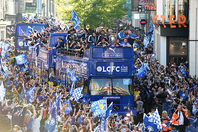 The Buses carrying the Leicester squad and trophy make their way through the the streets