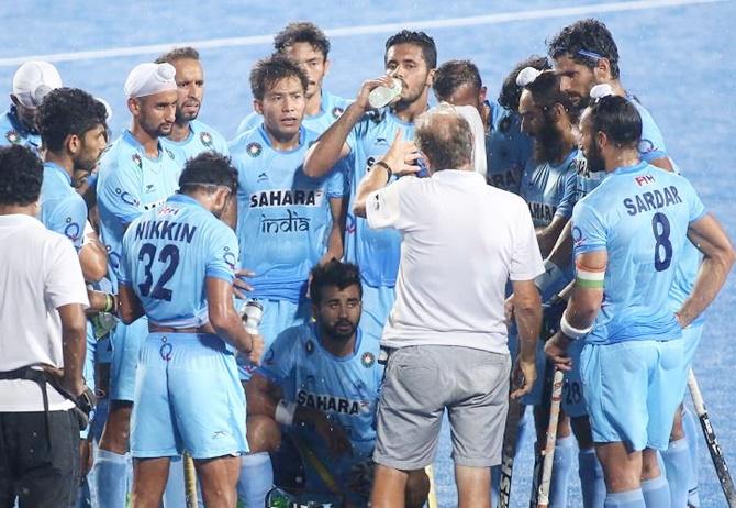  The Indian hockey team gets a pep talk from chief coach Roelant Oltmans