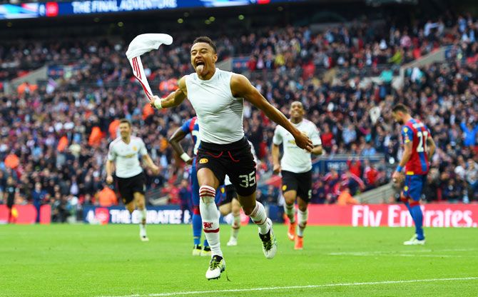 Manchester United's Jesse Lingard celebrates as he scores their second goal