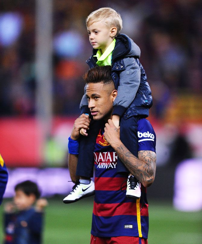 Looks like Neymar's ready to give his son David Luca a piggy-back ride