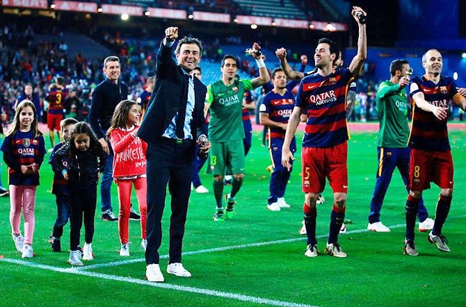 Coach Luis Enrique celebrates with his team