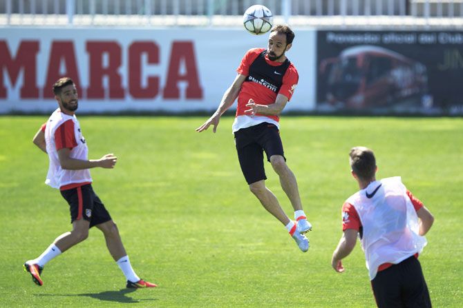 Juanfran (right) goes aeriel during a training session