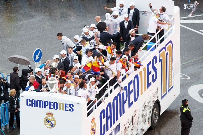 Champions Real Madrid celebrate with the Champions League trophy at Cibeles Square after winning the Uefa Champions League Final match against Club Atletico de Madrid on Saturday