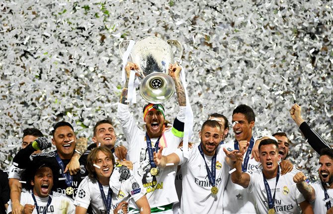 Sergio Ramos of Real Madrid of Real Madrid lifts the Champions League trophy after beating Atletico de Madrid to win the final at the San Siro stadium in Milan on Saturday