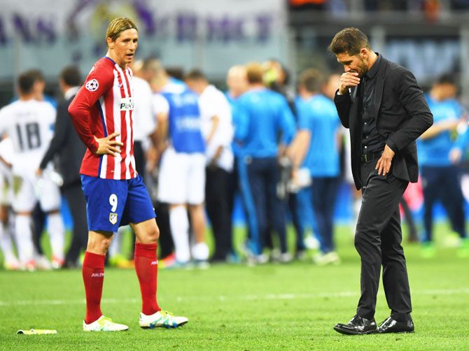 Atletico Madrid's Fernando Torres and head coch Diego Simeone during the UEFA Champions League final against Real Madrid on Saturday