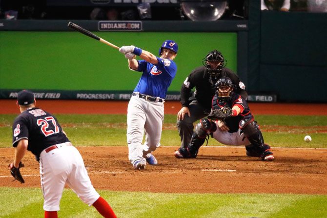Chicago Cubs' Miguel Montero hits a RBI single in the 10th inning against the Cleveland Indians