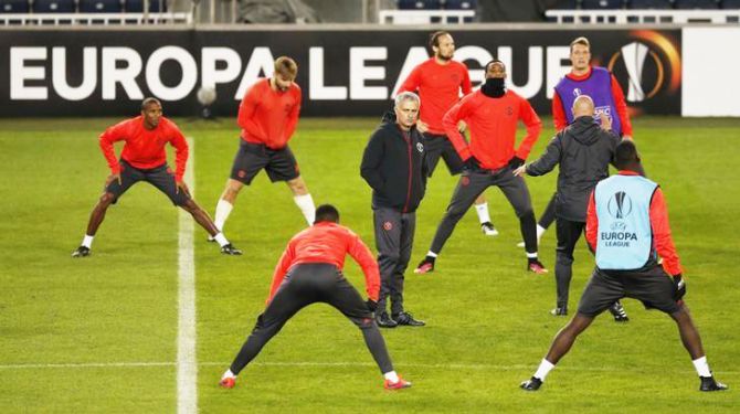 Manchester United's manager Jose Mourinho watches as his players train