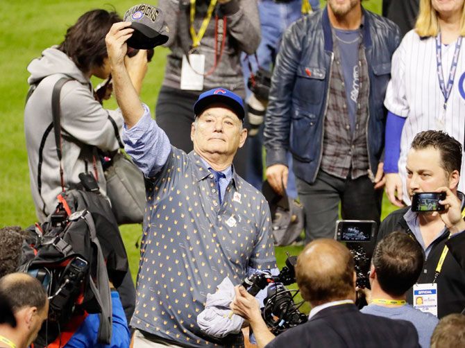 Hollywood actor Bill Murray celebrates on the field after the Chicago Cubs defeated the Cleveland Indians 8-7