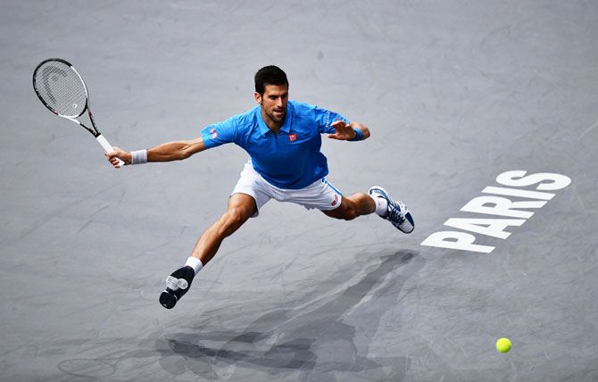 Serbia's Novak Djokovic stretches for a forehand against Luxembourg's Gilles Muller during the men's singles second round match at Paris Masters at Palais Omnisports de Bercy in Paris on Wednesday