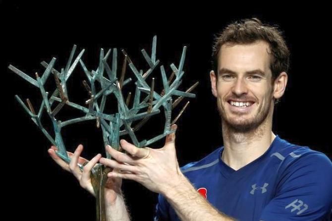 Andy Murray with the Paris Masters trophy after defeating USA's John Isner on Sunday