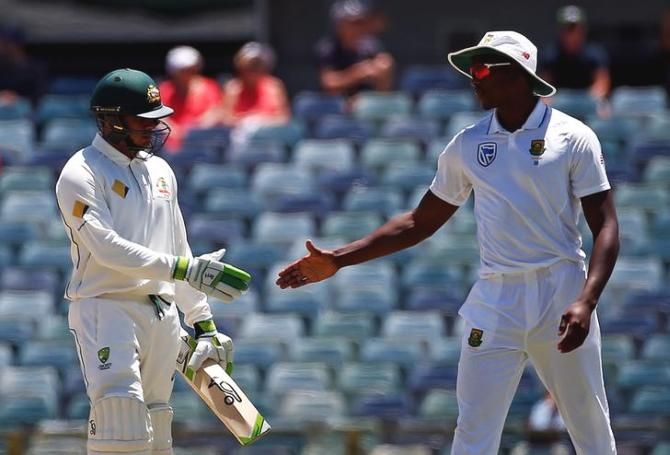 South Africa's Kagiso Rabada (right) shakes hands with Australia's Usman Khawaja after the latter's dismissal