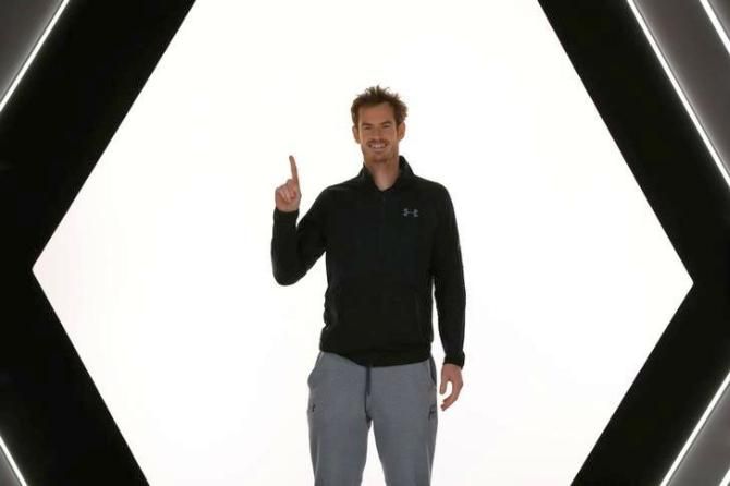 World No 1 Andy Murray poses for pictures after winning the Paris Masters on Sunday