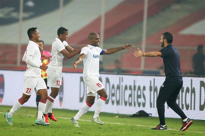 Delhi Dynamos' captain Florent Malouda celebrates after scoring his team's second goal during their against Chennaiyin FC during their ISL match in New Delhi on Wednesday