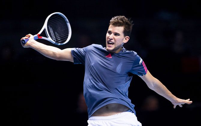 Austria's Dominic Thiem in action during his men's singles match against France's Gael Monfils on day three of the ATP World Tour Finals at O2 Arena in London on Tuesday