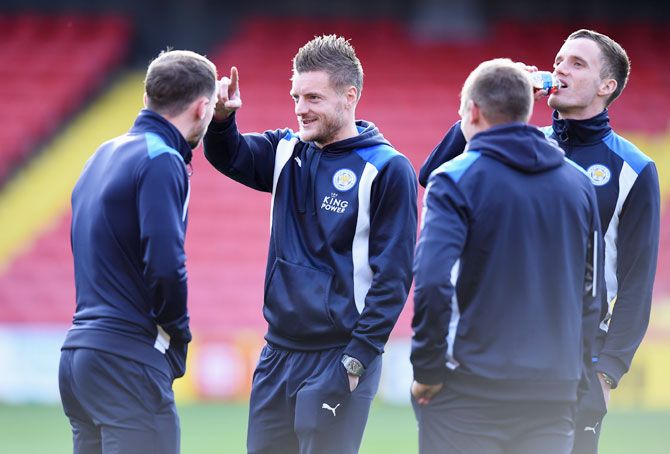 Leicester City's Jamie Vardy talks to his team mates during a warm-up session