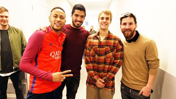 FC Barcelona's star strike force Neymar Jr (left), Luis Suarez (2nd from left) and Lionel Messi (right) with Canadian pop sensation Justin Bieber