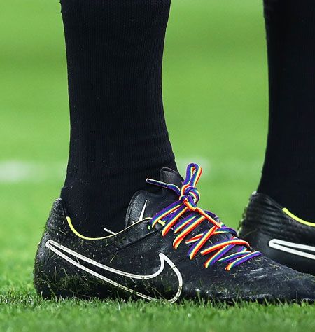 A match official wears rainbow coloured laces during the match between Liverpool and Sunderland on Saturday