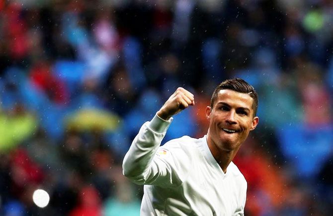 Real Madrid's Cristiano Ronaldo celebrates scoring against Sporting Gijon during their La Liga match at Santiago Bernabeu Stadium in Madrid on Saturday