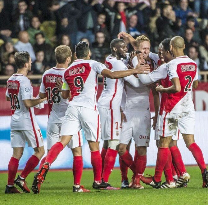 Players of AS Monaco celebrate a goal during the Ligue 1 match against Marseille on Sunday