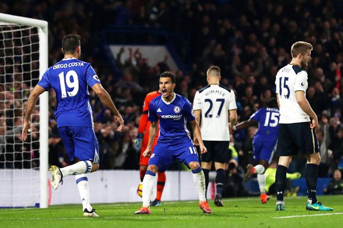 Chelsea's Pedro (centre) celebrates scoring his team's first goal with teammate Diego Costa (left) during the Premier League match against Tottenham Hotspur at Stamford Bridge in London on Saturday