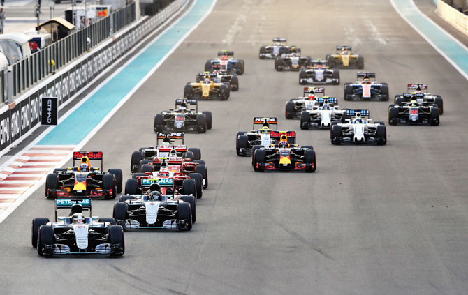Mercedes GP's Lewis Hamilton leads teammate Nico Rosberg, Ferrari's Kimi Raikkonen, Red Bull Racing's Daniel Ricciardo and the rest of the field at the start during the Abu Dhabi Formula One Grand Prix