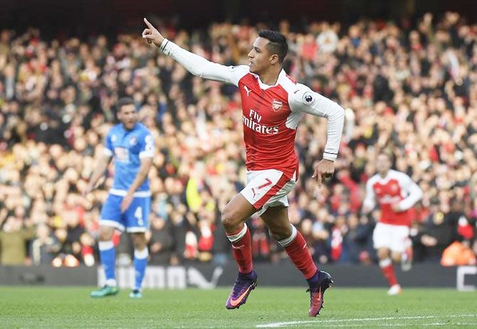 Arsenal's Alexis Sanchez celebrates scoring their first goal against Bournemouth during their English Premier League match at the Emirates Stadium on Sunday