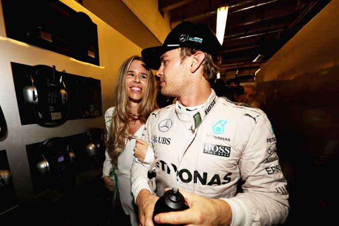 Nico Rosberg celebrates with wife Vivian Sibold after his F1 title triumph on Sunday