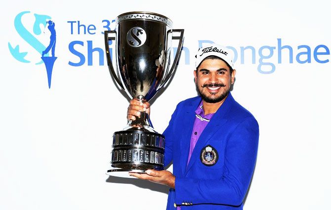 India’s Ganganjeet Bhullar poses with the trophy after his win at the Shinhan Donghae Open in Incheon, South Korea on Sunday, for his sixth title on the Asian Tour