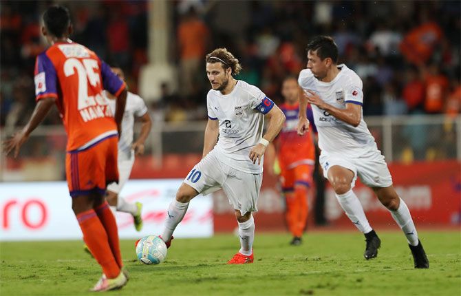 Mumbai City FC 's marquee player Diego Forlan (centre) in action during their ISL match against Pune City FC in Pune on Monday