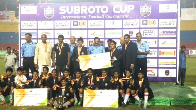The Girls Senior Secondary School team celebrate on winning the 57th Subroto Cup title