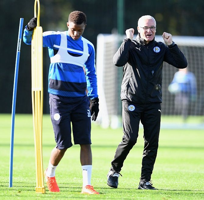 Demarai Gray and Claudio Ranieri, manager of Leicester City look on during a training session 