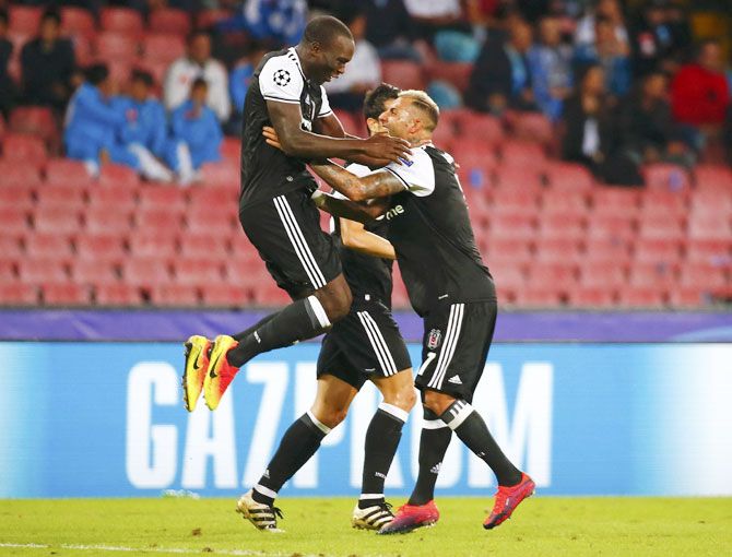 Besiktas' Vincent Aboubakar celebrates with teammates after scoring against Napoli