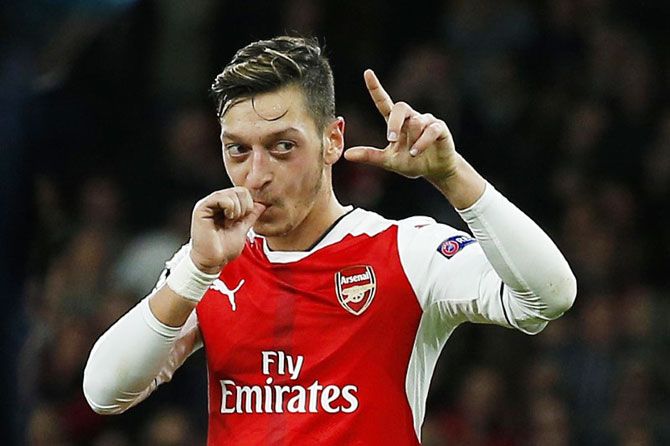Arsenal's Mesut Ozil celebrates scoring their sixth goal and his hat trick against PFC Ludogorets Razgrad during their Group A match at Emirates Stadium