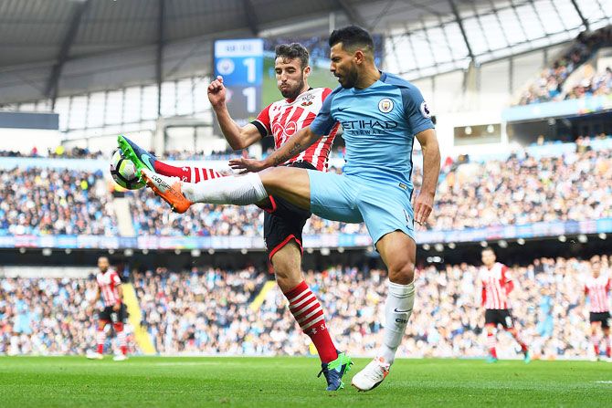Southampton's Sam McQueen closes down Manchester City's Sergio Aguero during their Premier League match at Etihad Stadium in Manchester on Sunday