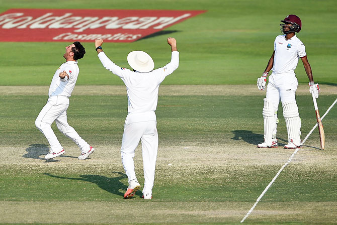 Pakistan's Yasir Shah celebrates taking the wicket of West Indies' Marlon Samuels on day 4 of the Second Test at Zayed Cricket Stadium in Abu Dhabi, United Arab Emirates, on Monday