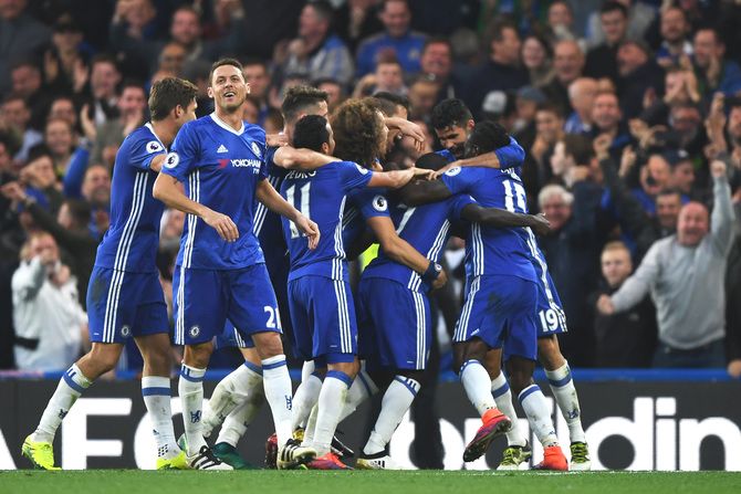 Chelsea's N'Golo Kante celebrates with teammates on scoring fourth goal against Manchester United during the Premier League match at Stamford Bridge in London, England, on Sunday