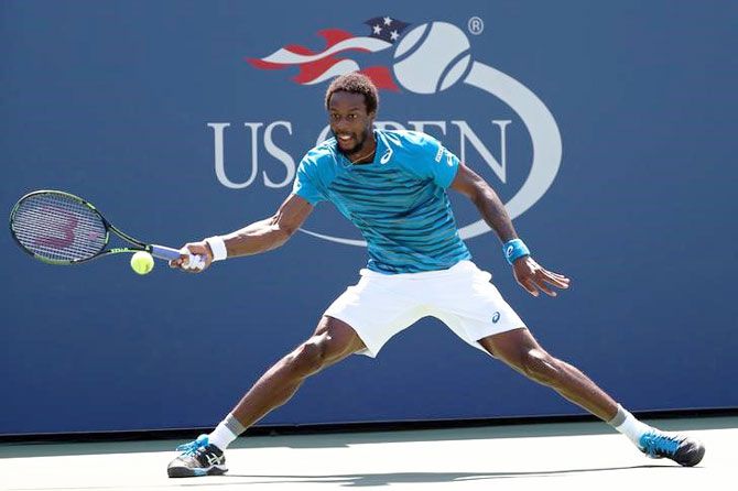 Gael Monfils of France reaches for a forehand against Marcos Baghdatis of Cyprus 