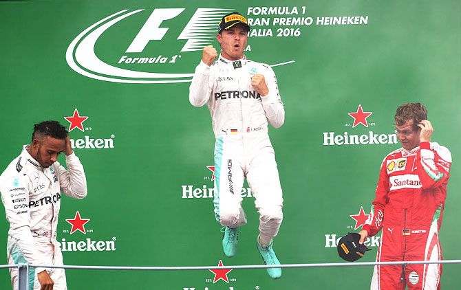 Mercedes GP's German driver Nico Rosberg celebrates his win at the Italian F1 GP at Autodromo di Monza on in Monza, Italy, on Sunday