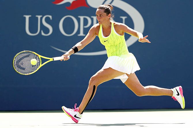 Italy's Roberta Vinci returns a shot to Ukraine's Lesia Tsurenko during her fourth round Women's Singles match on Day Seven of the 2016 US Open at the USTA Billie Jean King National Tennis Center at the Flushing Meadows in New York City on Sunday