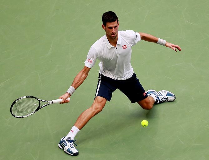 Novak Djokovic returns a shot during his semi-final match against Gael Monfils at the 2016 US Open