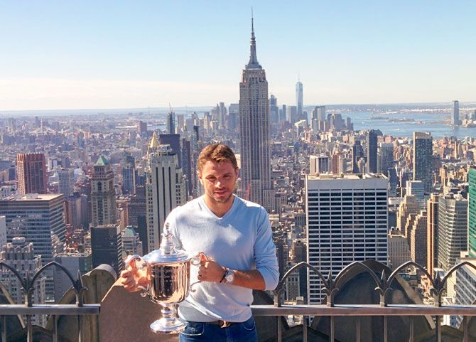 Stan Wawrinka of Switzerland, winner of the 2016 U.S. Open tennis tournament poses with the trophy in Manhattan, New York on Monday