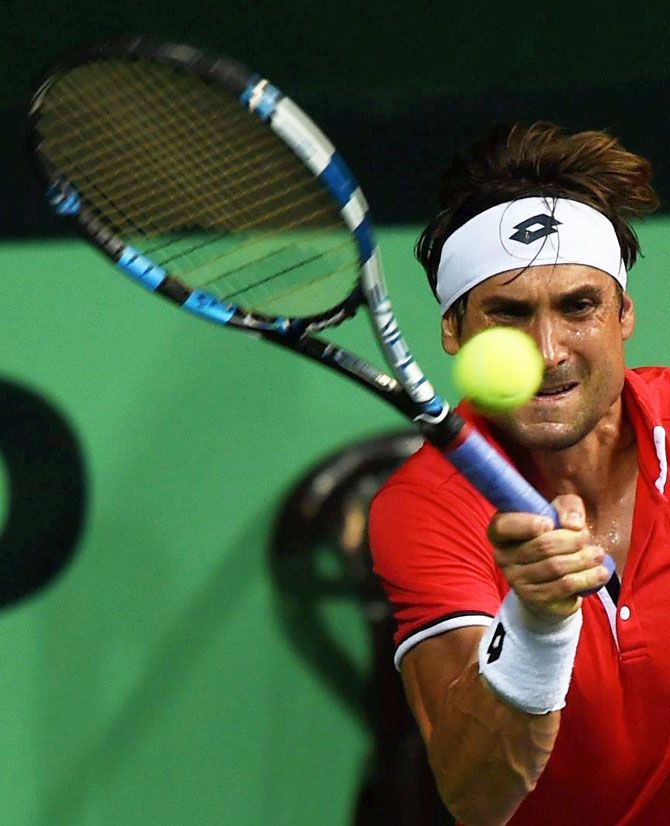Spain's David Ferrer in action against India's Saketh Myneni during their Davis Cup World Group Play-off tie in New Delhi on Friday