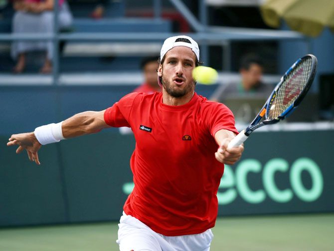 Spain's Feliciano Lopez in action aganist India's Ramkumar Ramanathan during the Davis Cup World Group play-off match in New Delhi on Friday