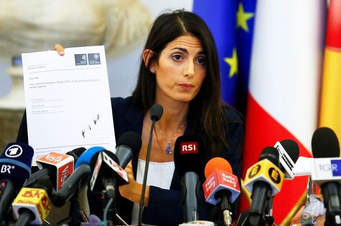 Rome's new mayor Virginia Raggi holds a document during a news conference in Rome on Wednesday
