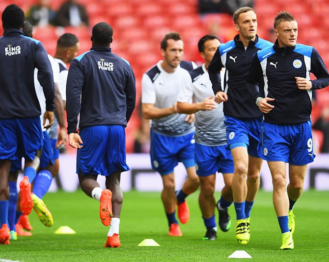Jamie Vardy of Leicester City, right, warms up with his team mates