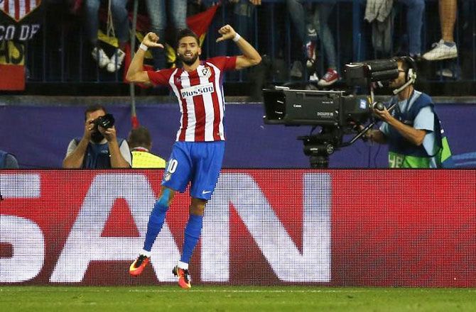 Atletico Madrid's Yannick Carrasco celebrates scoring against Bayern Munich during their match at the Vicente Calderon stadium in Madrid on Wednesday