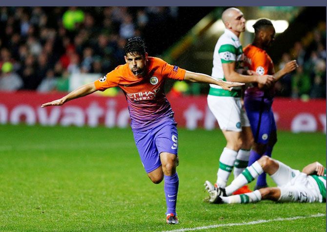 Manchester City's Nolito celebrates scoring their third goal against Celtic during their match in Celtic Park, Glasgow