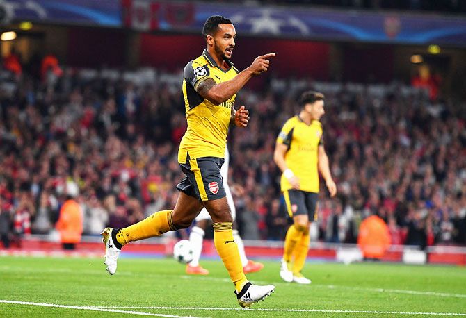 Arsenal's Theo Walcott ceclebrates after scoring the opening goal against FC Basel 1893 at the Emirates Stadium in London on Wednesday