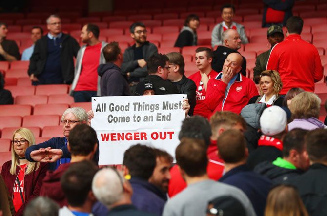 Arsenal fans vent out their thoughts during the English Premier League match between Arsenal and Manchester City on Sunday