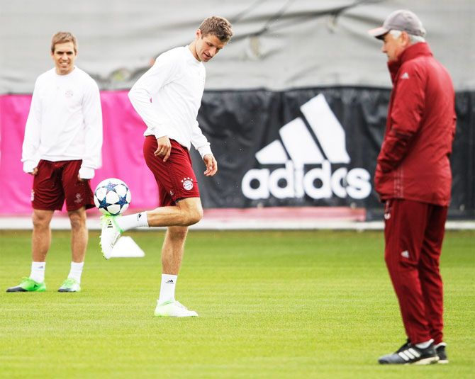 Bayern Munich's Thomas Muller and Philipp Lahm at a team training session on Tuesday